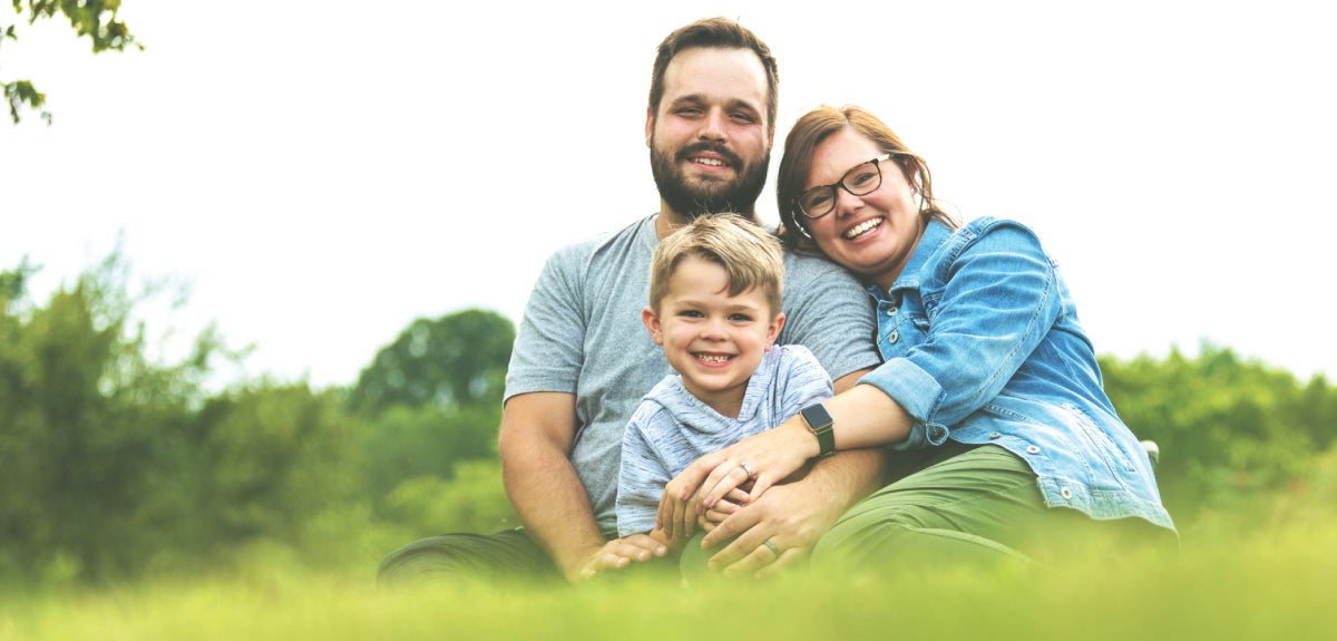Family sitting on grass